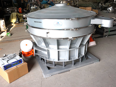 Inline vibrating sieve