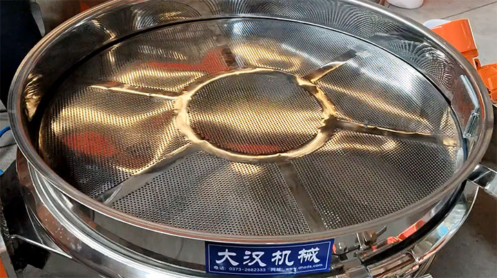Top view of a stainless steel vibrating screen mesh with a support frame.