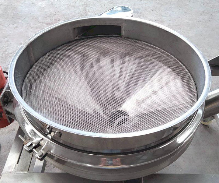 Fine stainless steel woven mesh installed in a vibrating screen frame with quick-release clamps.